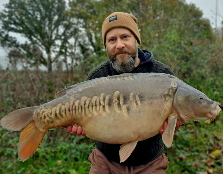 Paul Martin with a large Carper's Retreat mirror carp